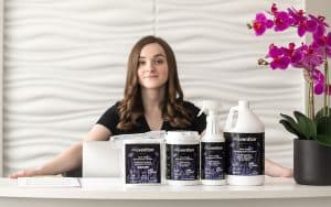 Spa professional with Prevention Disinfectant Wipes and Ready-to-Use Spray products
