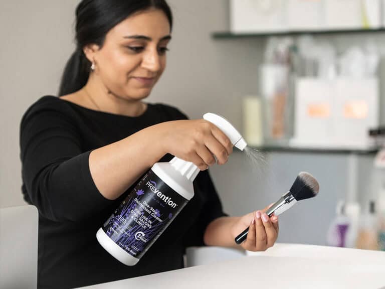 Disinfecting a makeup brush with Prevention RTU Spray